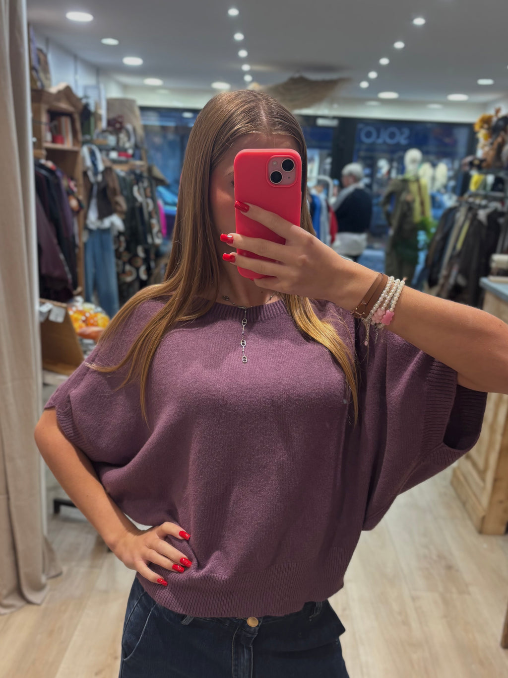 Pull mauve sans manches à col rond