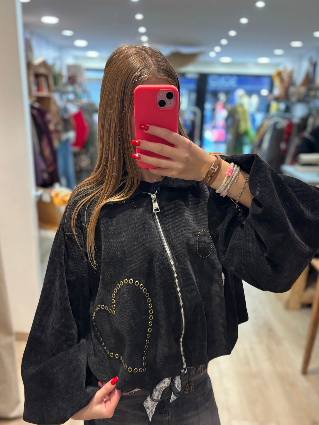 Veste courte zippée à œillets décoratifs