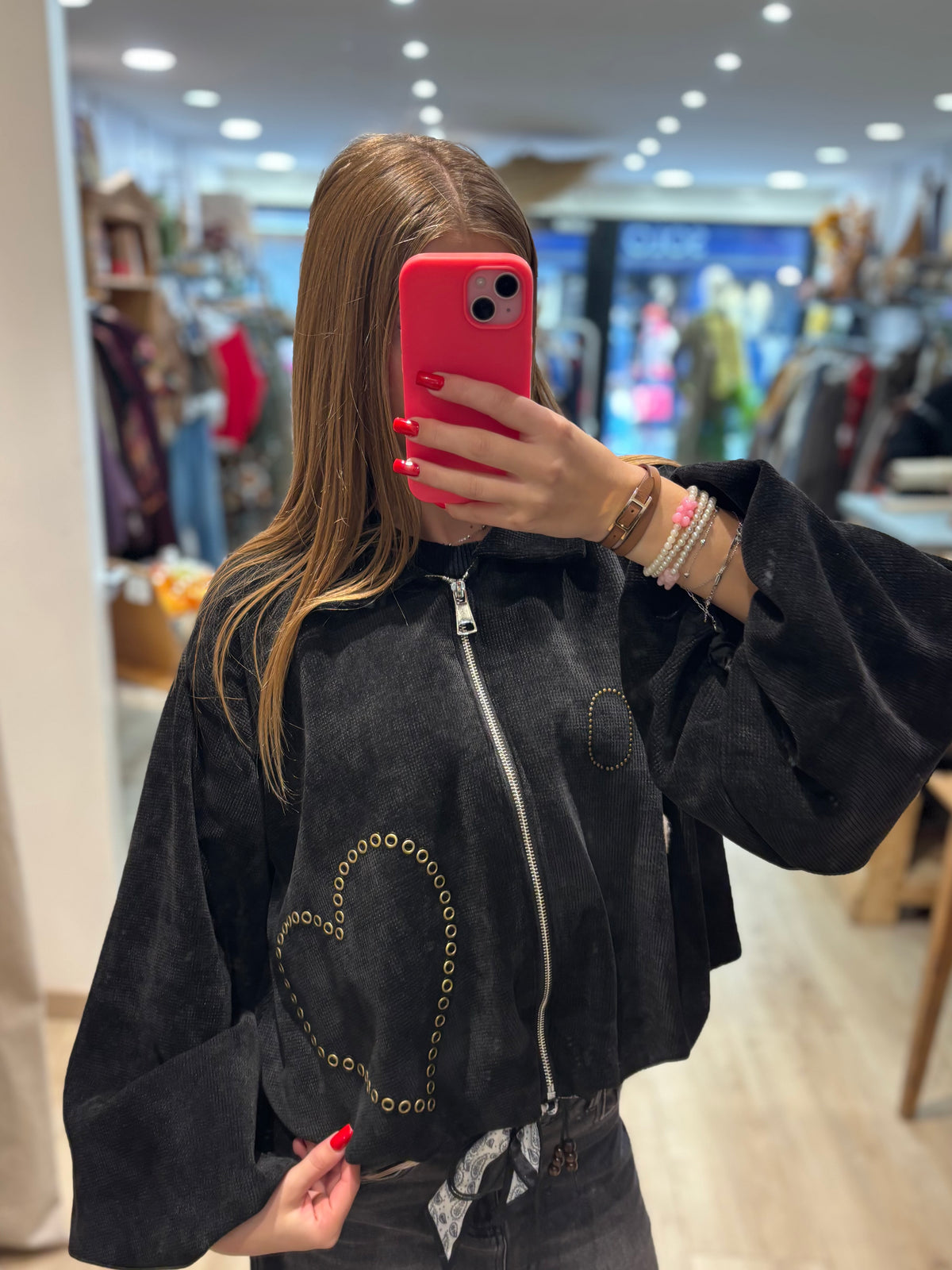 Veste courte zippée à œillets décoratifs