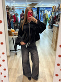 Veste courte zippée à œillets décoratifs