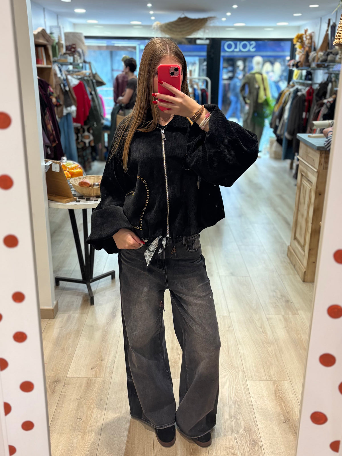 Veste courte zippée à œillets décoratifs