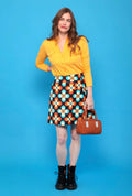 Jupe courte à fleurs orange, turquoise et écru